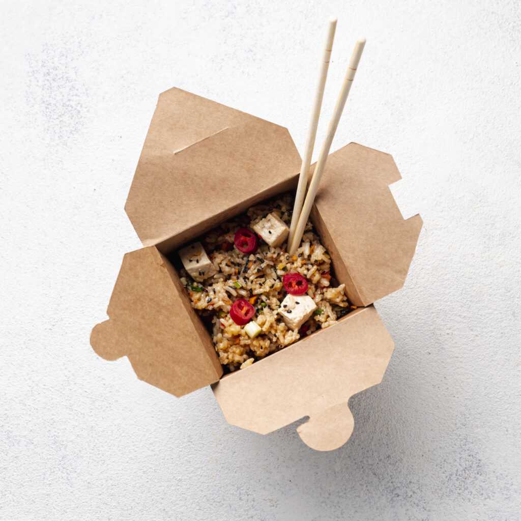 flat-lay-rice-vegetables-takeaway-with-chopsticks