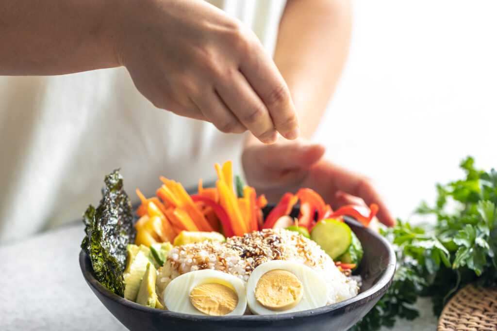Homemade bowl with rice, vegetables and eggs.